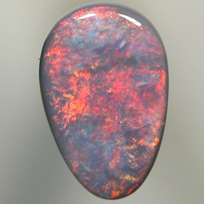 SOLID SEMI BLACK OPAL Fire red and copper orange sweeps over the opal